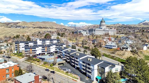 A view of a city with a large building in the background.