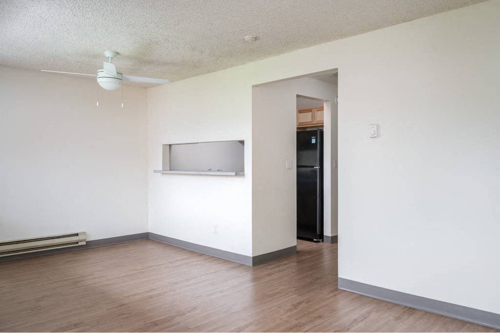 an empty living room with a tv on the wall at Fort Vancouver Terrace, Washington, 98661