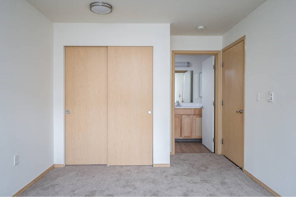 an empty room with white walls and a wood floor  at Fort Vancouver Terrace, Washington