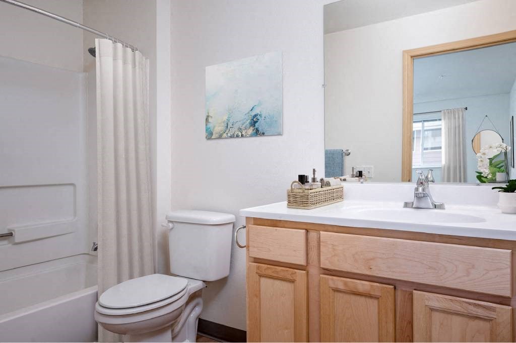 a bathroom with a sink toilet and a shower at Fort Vancouver Terrace, Vancouver, Washington