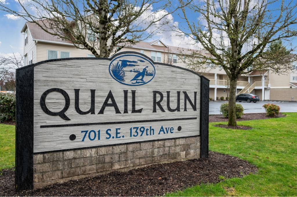 a sign for the a sign for the quail run apartments Apartments, Vancouver, WA