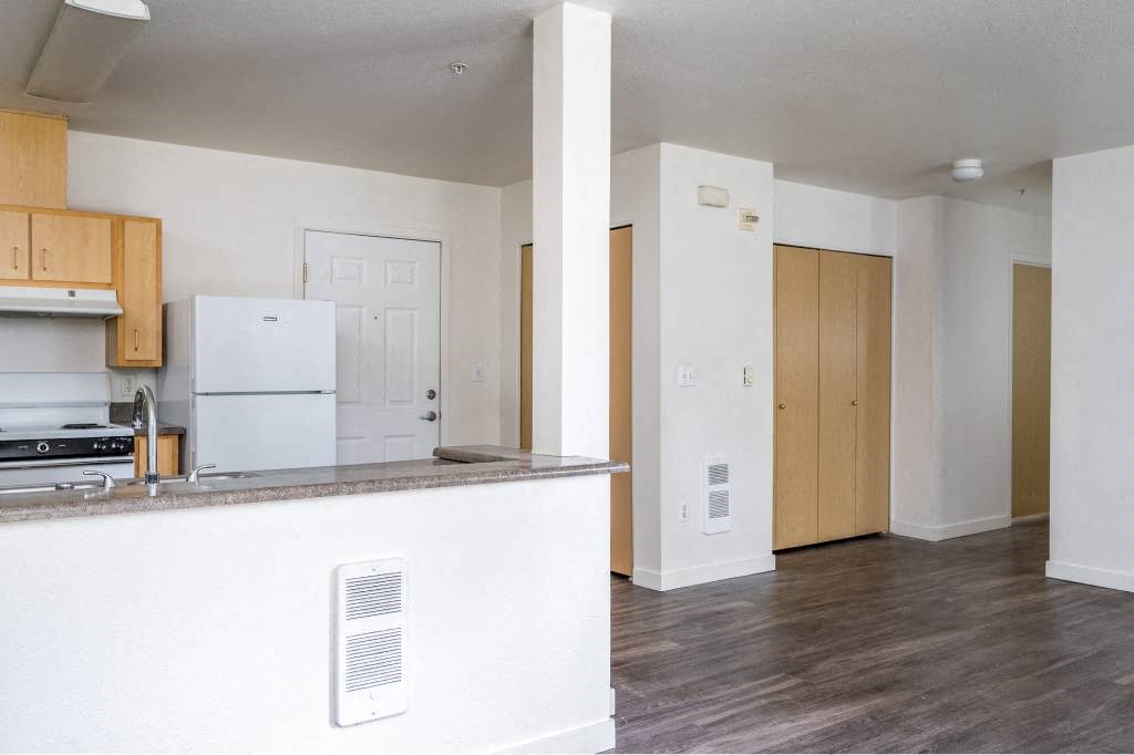 an empty kitchen with white cabinets and a counter top at Quail Run Apartments, Vancouver, WA 98684