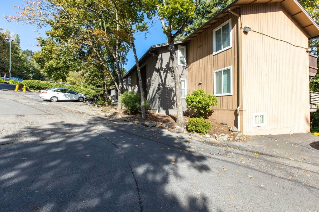 a house with a car parked in front of it at Whisperwood, Seattle, WA 98168