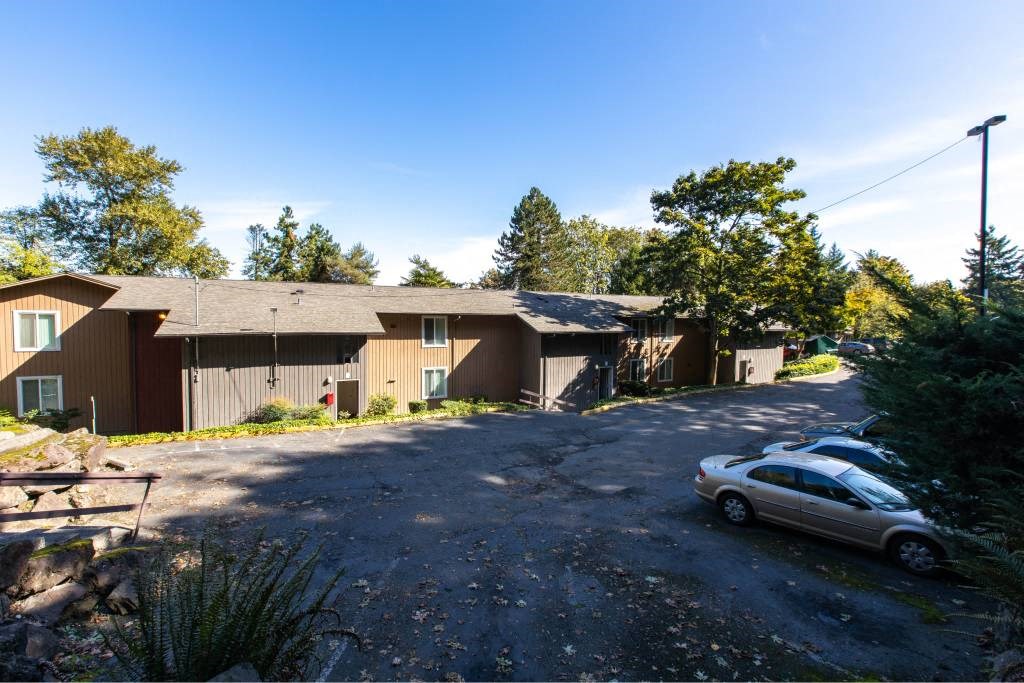 Distant photo of apartment building at Whisperwood, Washington