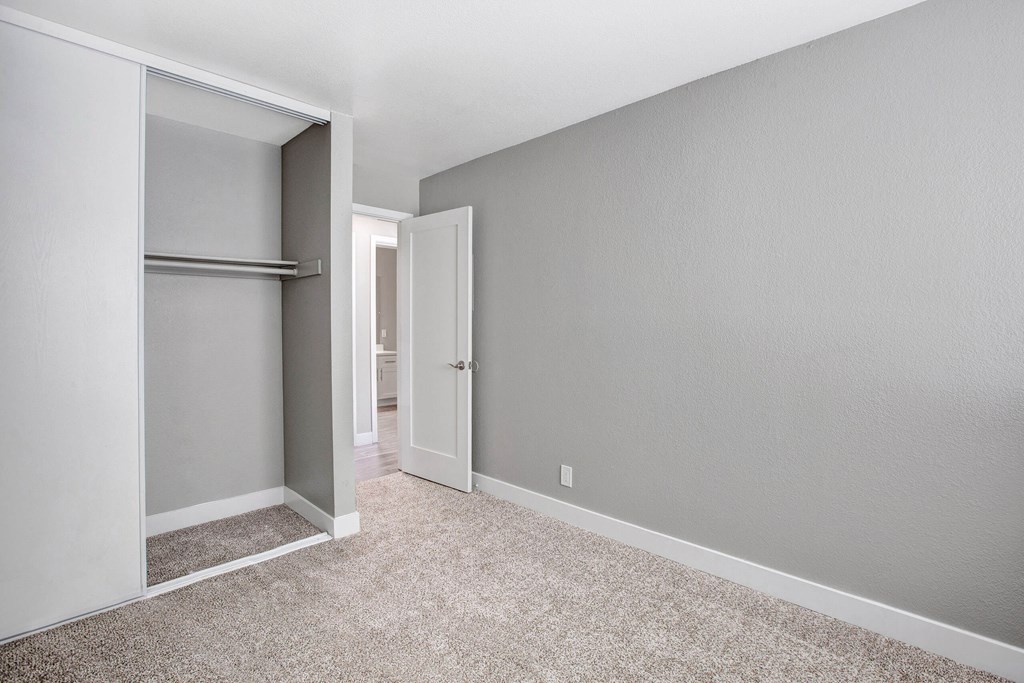A room with a white door and a white wall at The Henley Apartments, Suisun City, CA