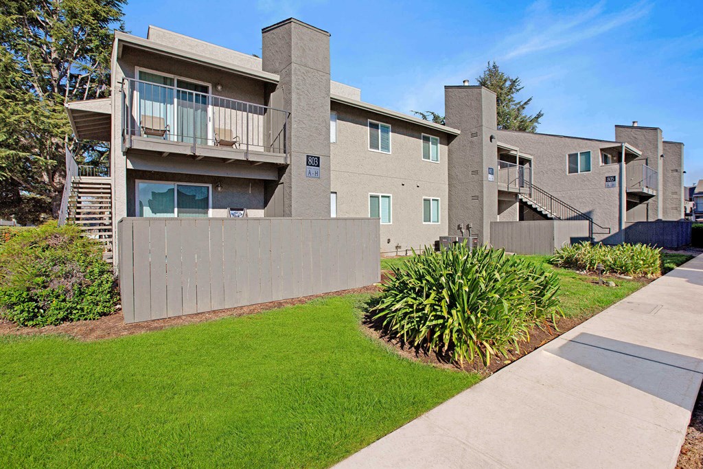 Apartment complex with a green lawn in front at The Henley Apartments, Suisun City, California