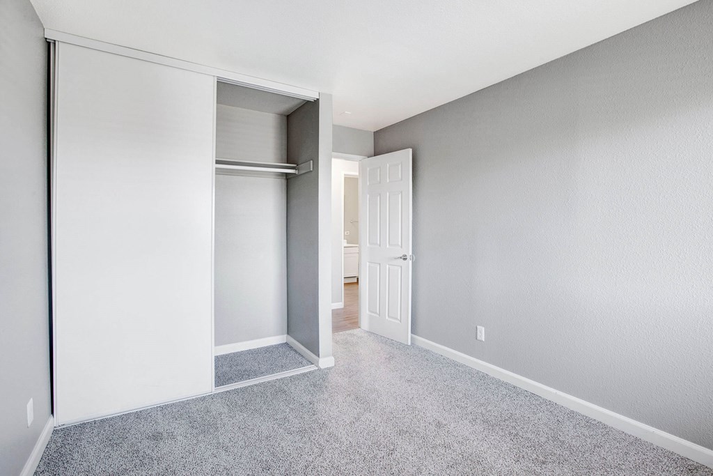 A room with a white door and a white wall at The Henley Apartments, Suisun City