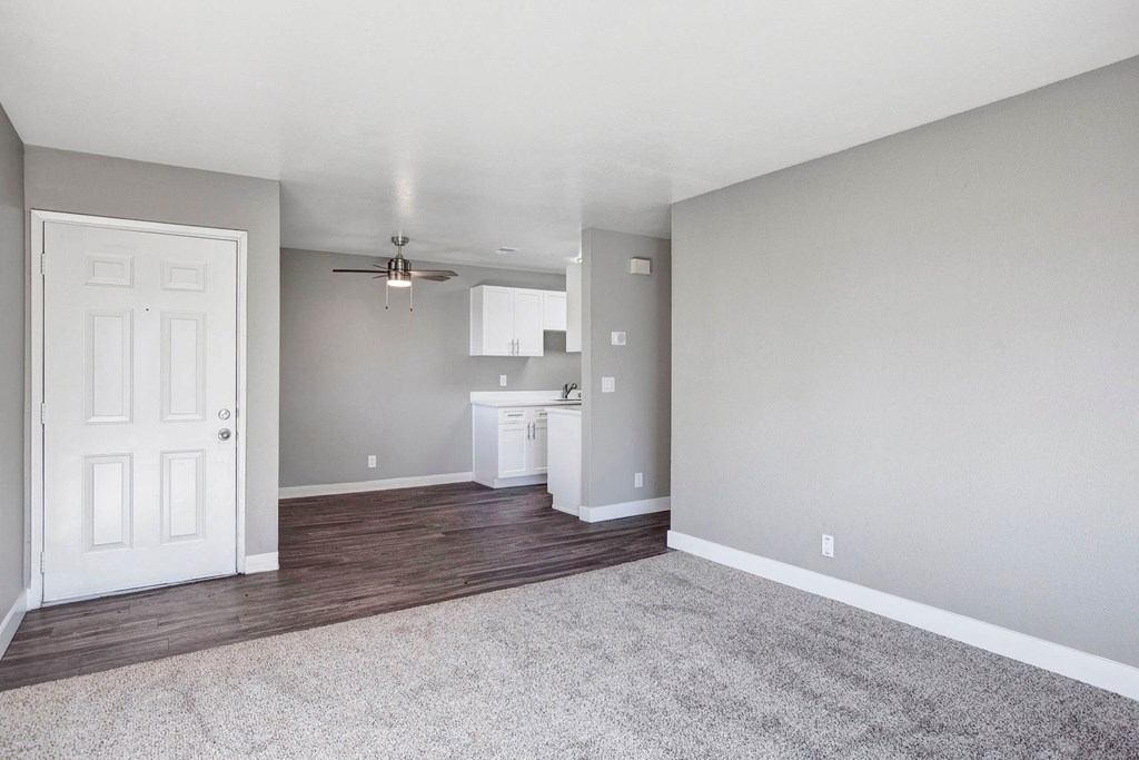 A room with a white door and a white cabinet with a fan above it at The Henley Apartments, California, 94585