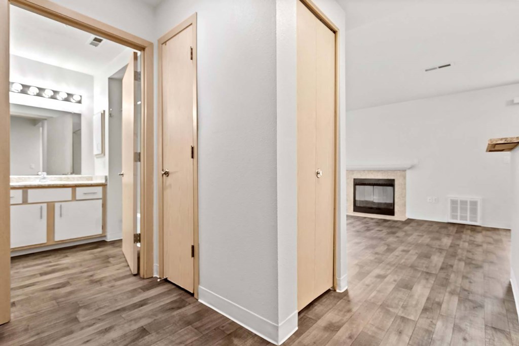 A room with a white wall and a wooden floor.at Maple Ridge, Vancouver, WA