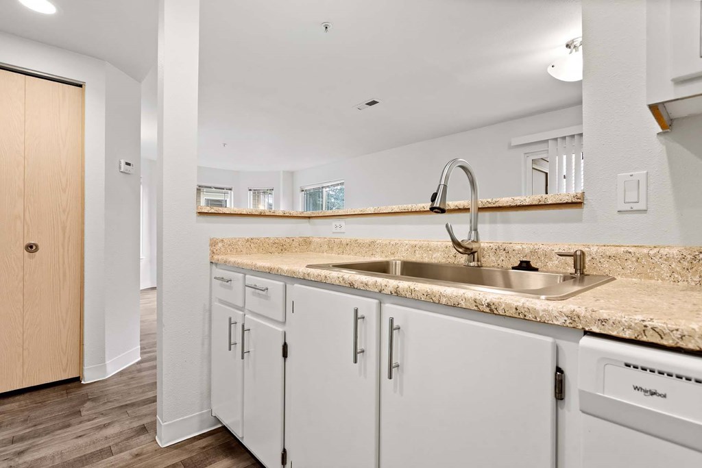 A kitchen with a sink and cabinets.at Maple Ridge, Washington