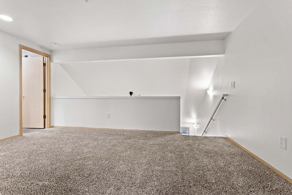 A room with a carpeted floor and a white ceiling.at Maple Ridge, Vancouver, 98664
