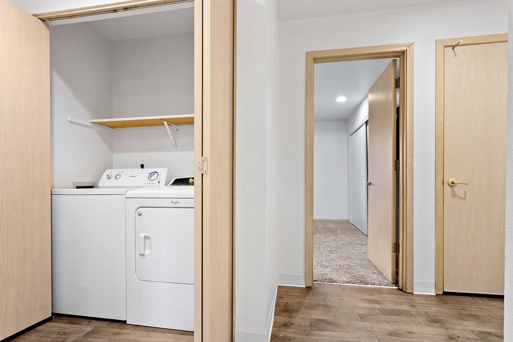 A laundry room with a washer and dryer.at Maple Ridge, Vancouver, 98664