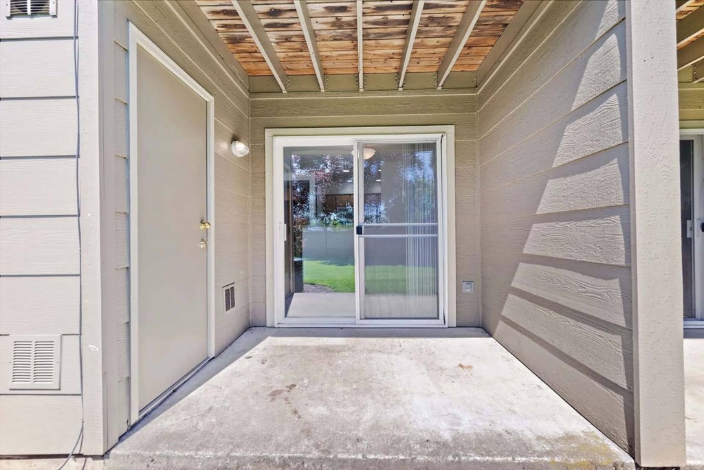 A patio area with a door and a window.at Maple Ridge, Vancouver Washington