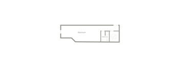 A floor plan of a bedroom with a bathroom attached.