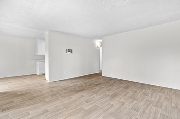 Large living room with wood floors l Palmilla Apartments - Photo Gallery 5