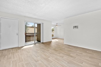 Living room with patio door and wood floors - Photo Gallery 6