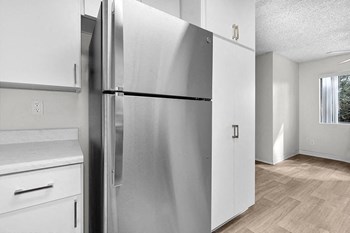 Stainless steel refrigerator near counter l Palmilla Apartments - Photo Gallery 3
