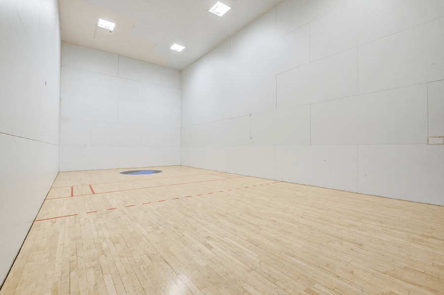 A squash court with a blue disc in the middle at Kirker Creek Apartments, California