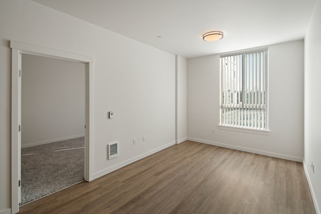 Unit image with carpet in bedroom and hardwood floors in living spaces