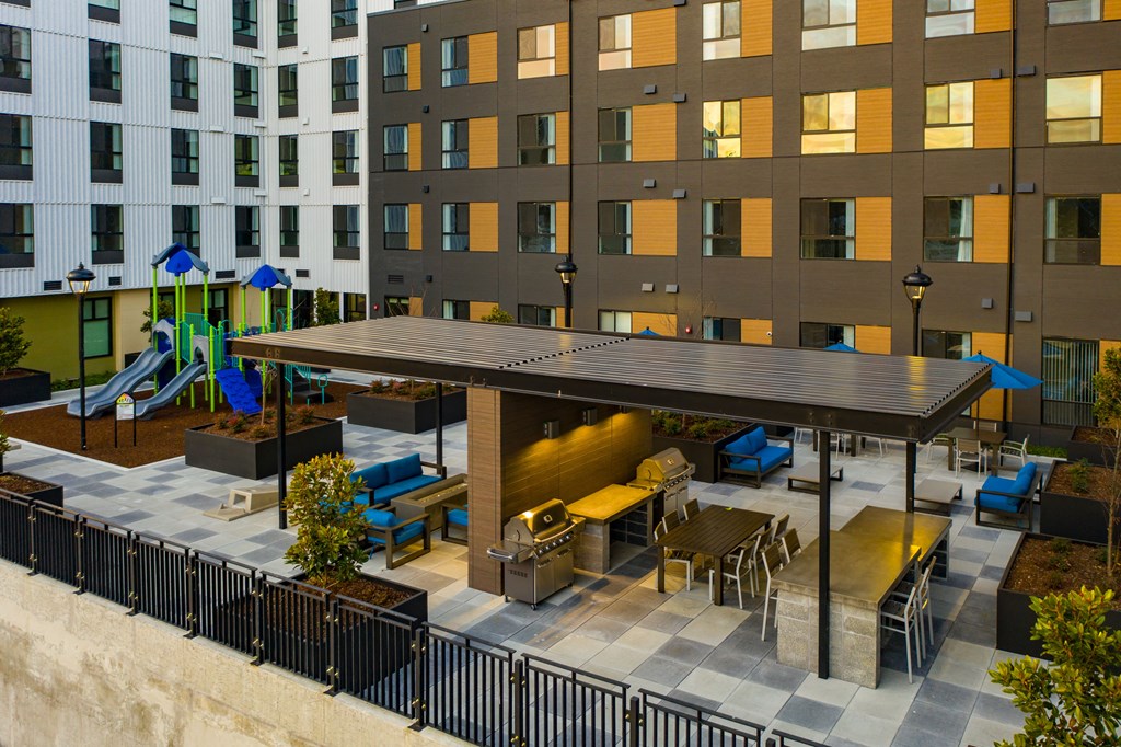Aerial view of courtyard with covered picnic seatings and bbq grills
