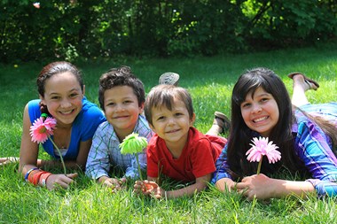 Kids laying in the grass