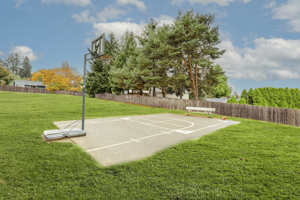 Apartments in Sherwood, OR- Township Sherwood- Basketball Court with Bench and Various Trees