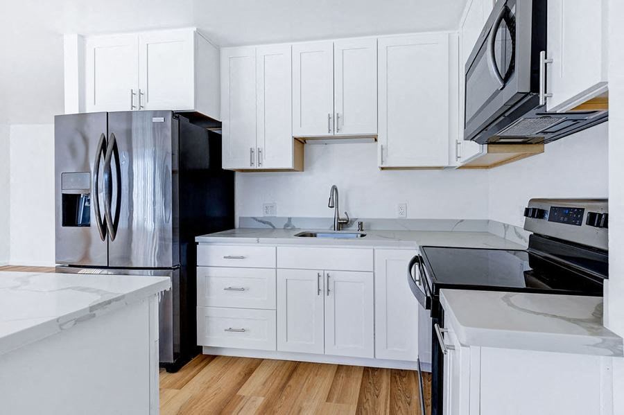 kitchen with white cabinets and appliances