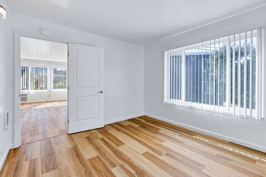 Bedroom with wood floors and window