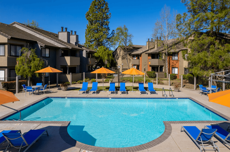 Pool with lounge chairs and umbrellas