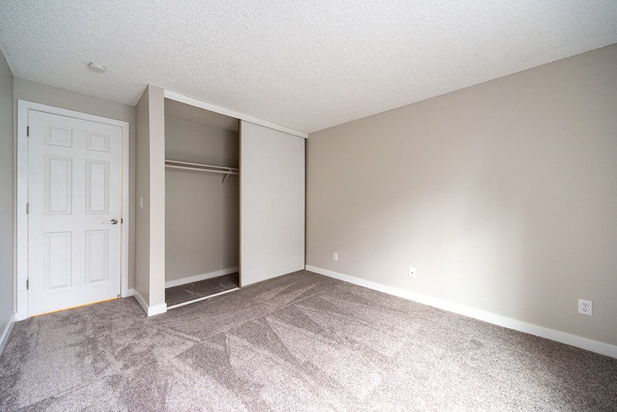 bedroom with window and closet