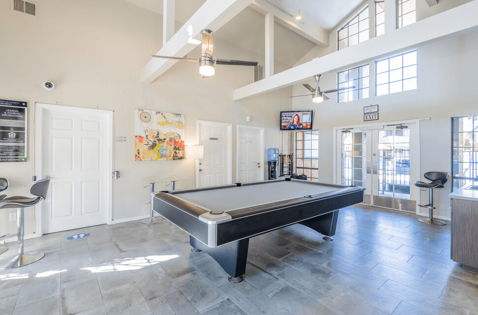 Pool table near seating and TV