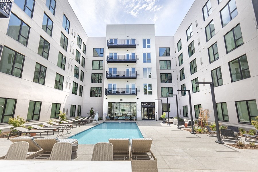 Downtown Sac Apartments - The Mansion - Sparkling Pool Surrounded by Lounge Seating