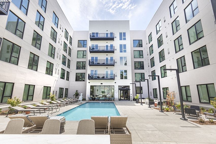 Downtown Sac Apartments - The Mansion - Sparkling Pool Surrounded by Lounge Seating - Photo Gallery
