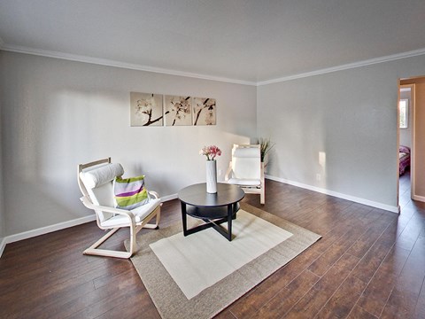 The Post Apartments living area with plank flooring at THE POST Apartments, California