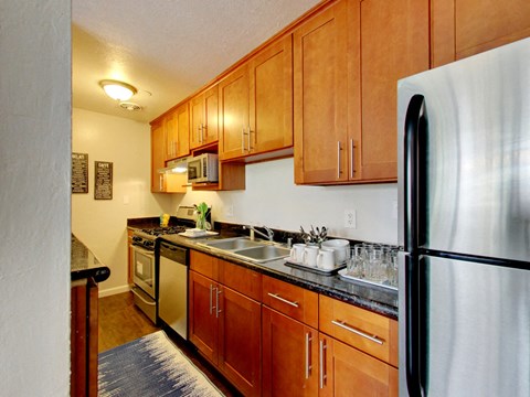 The Post Apartments kitchen area with stainless steel appliances at THE POST Apartments, PLEASANT HILL , California