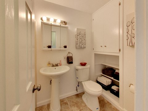 The Post Apartments bathroom with vanity and storageat THE POST Apartments, California, 94523