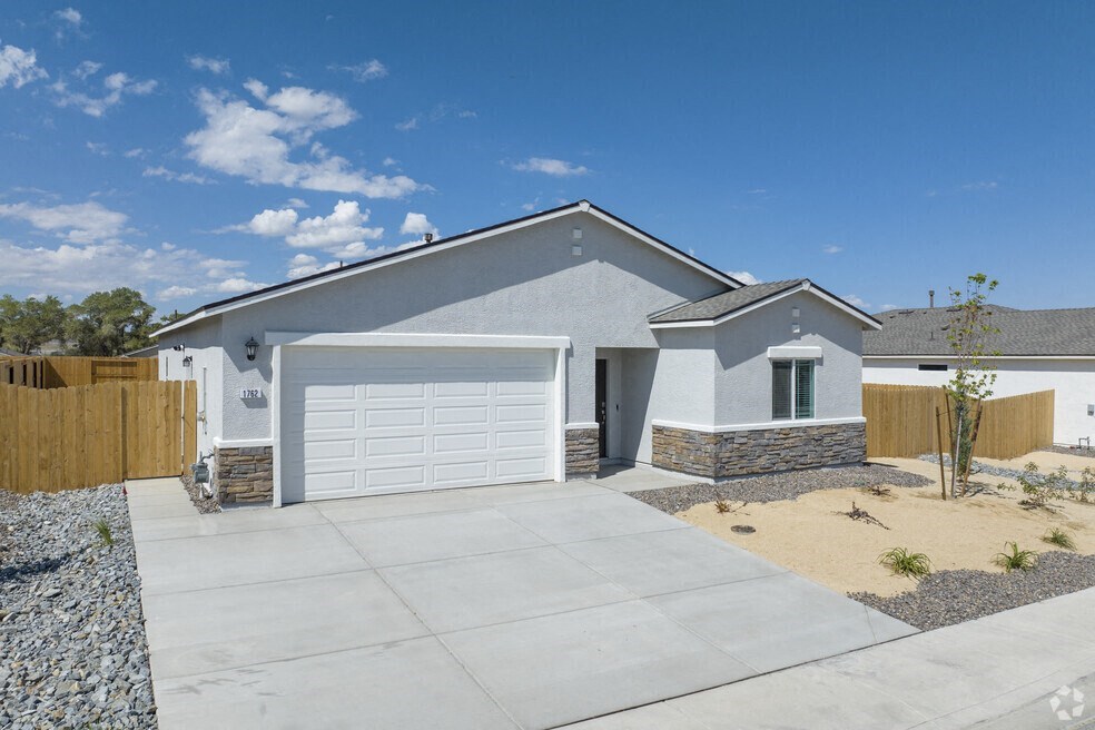 a house with a white garage door and a driveway