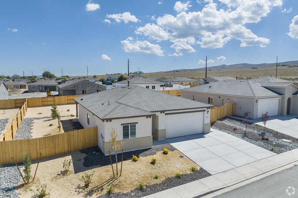 an aerial view of a group of houses in a desert