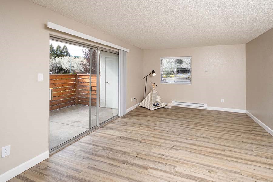Living room with wood flooring and patio window