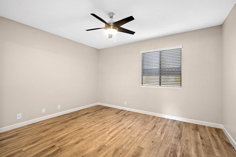 Bedroom with wood floors and window