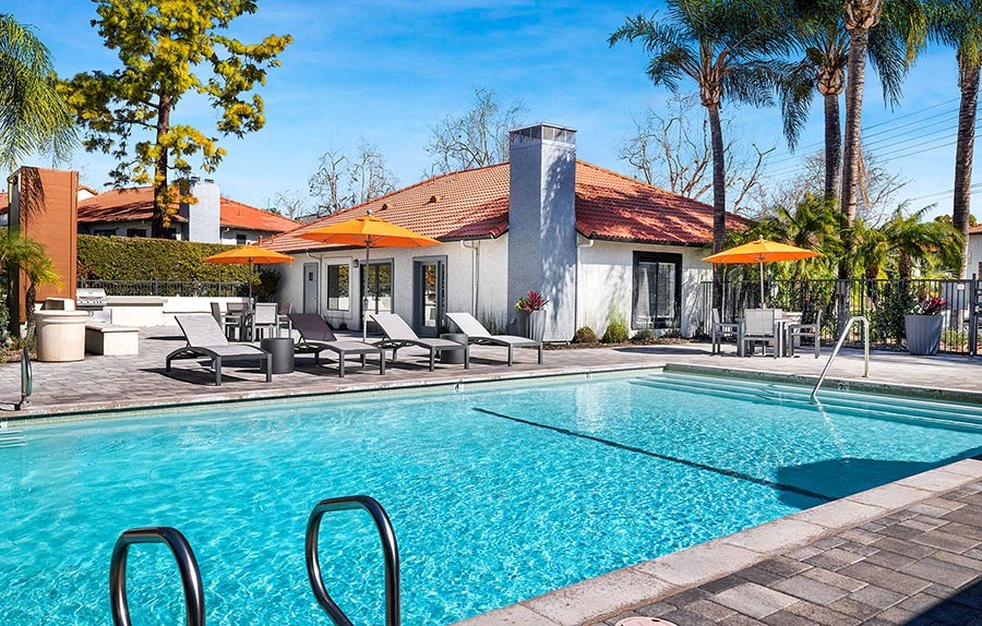 Pool with lounge chairs and umbrellas