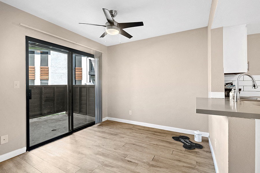 Dining with wood floors near kithcen