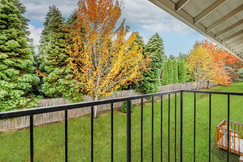 Township Sherwood Exterior balcony, lush landscaping, fall foliage at TOWNSHIP SHERWOOD, Sherwood