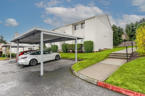 Apartments in Sherwood for Rent - Township Sherwood - Manicured Landscape, Trees, Parking area, and White Apartment Complexes at TOWNSHIP SHERWOOD, Oregon, 97140