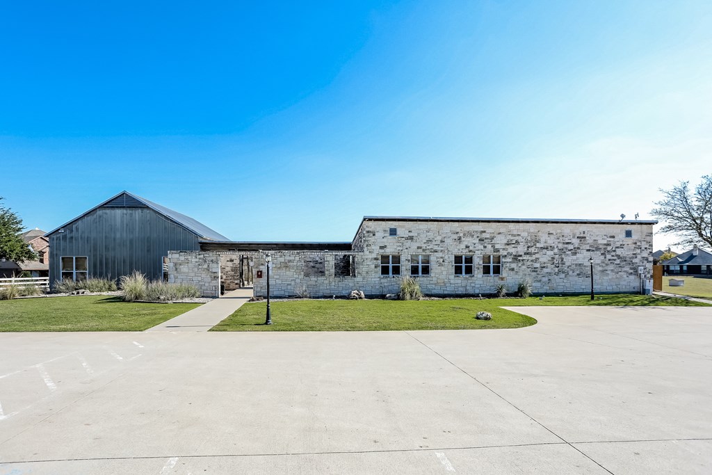 an old stone building with a blue sky in the background