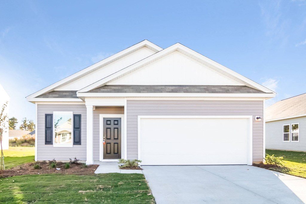 a white house with a white garage door