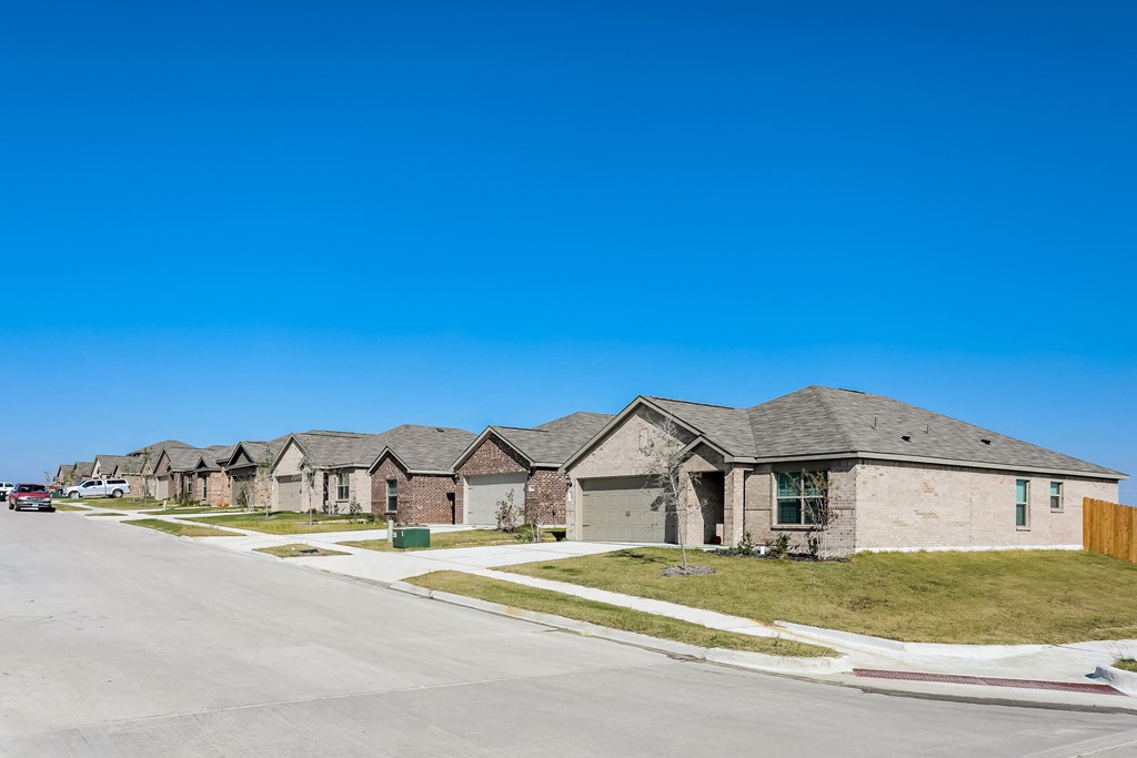 a row of houses on the side of a street