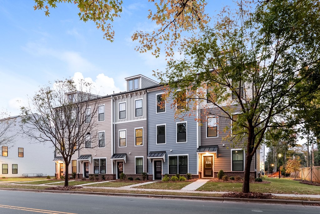 Charlotte, NC Luxury Apartments for Rent - Loso Walk - Exterior of Townhomes with Large Windows, Beautiful Landscaping, and Sidewalks