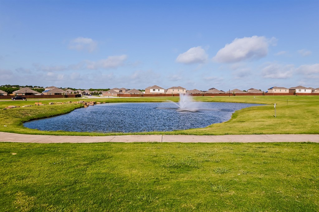 Forney, TX Houses for Rent - Windmill Farms - Pond with Fountain in a Large Green Space with View of Houses
