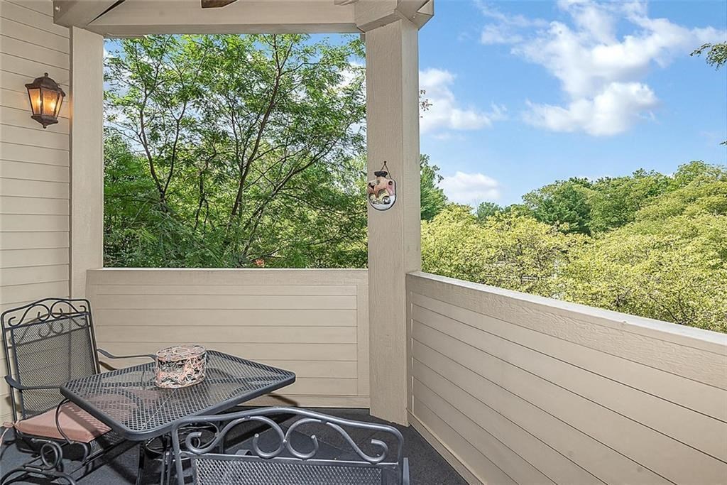a patio with a table and chairs on it